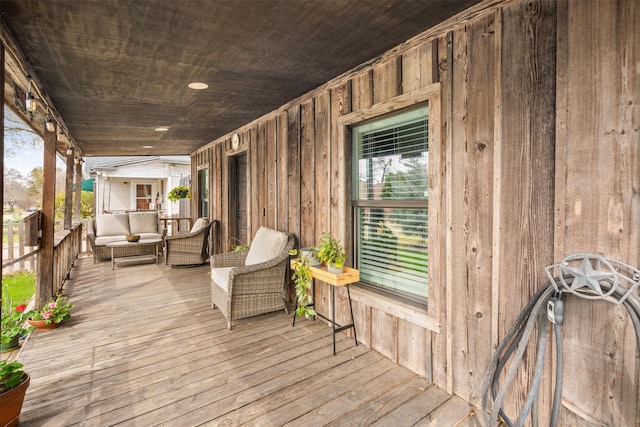 wooden terrace with a porch