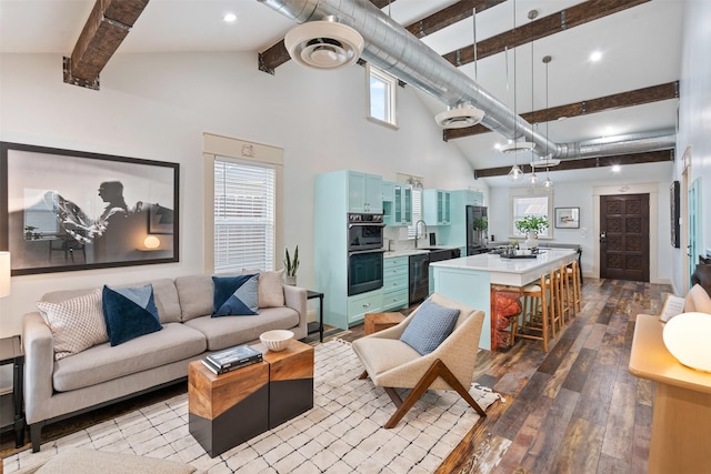 living room with hardwood / wood-style floors, beamed ceiling, and high vaulted ceiling