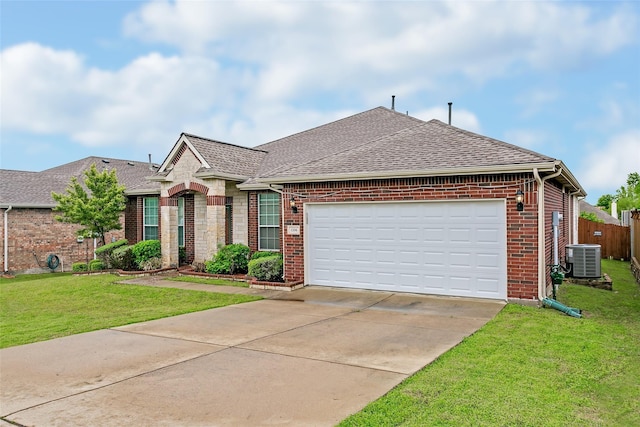 ranch-style home with driveway, central AC, roof with shingles, a front yard, and brick siding