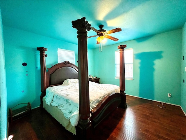 bedroom featuring hardwood / wood-style floors and baseboards