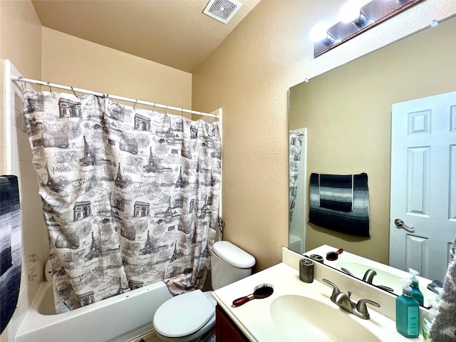 full bath featuring vanity, visible vents, shower / tub combo, toilet, and a textured wall