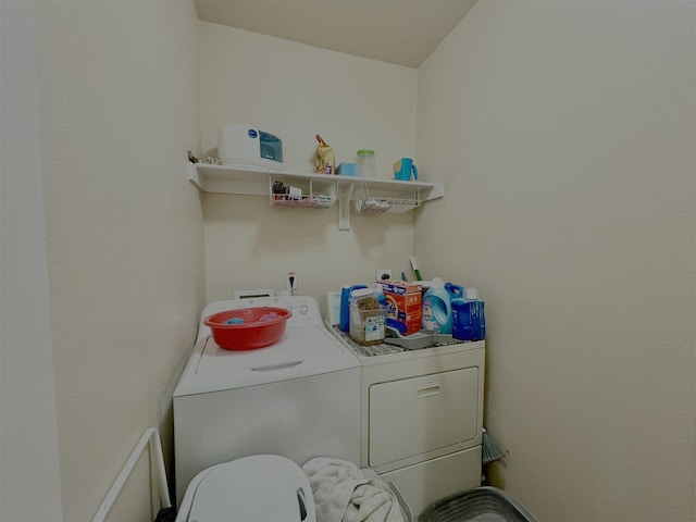 laundry area with laundry area and separate washer and dryer