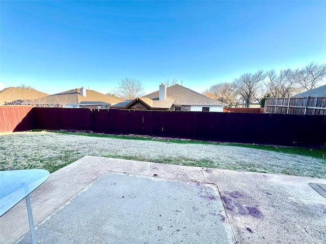 view of yard with a fenced backyard