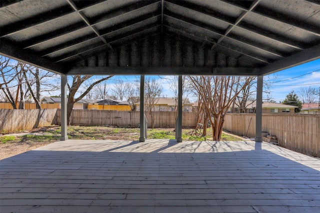 wooden deck featuring a fenced backyard