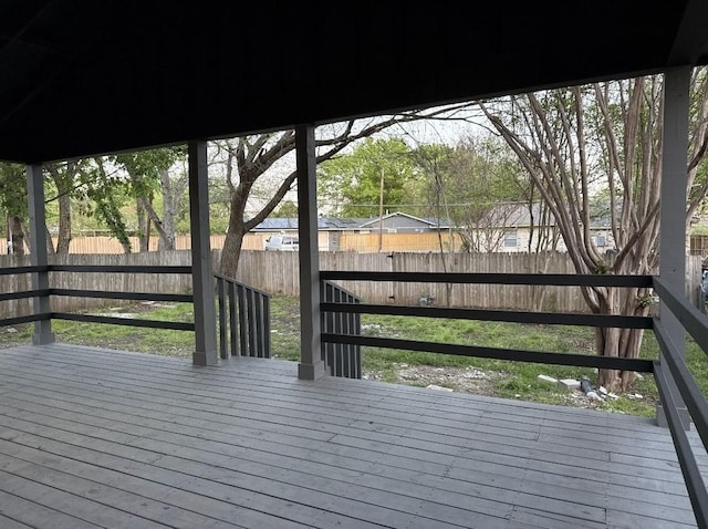 deck with a fenced backyard