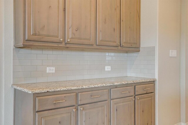 6328 Red Cliff Dr, Fort Worth, TX 76179 - kitchen featuring decorative backsplash and light stone countertops