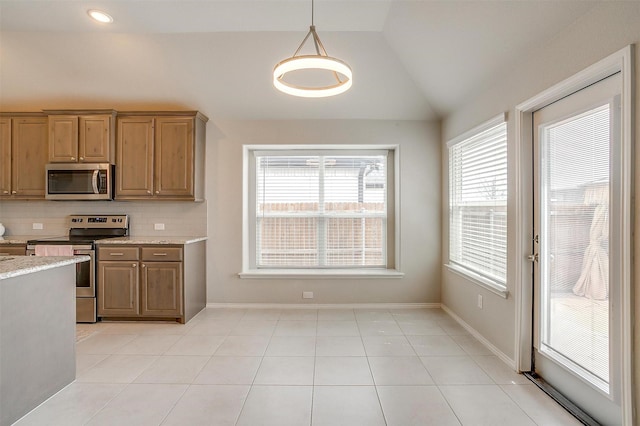 6328 Red Cliff Dr, Fort Worth, TX 76179 - kitchen with appliances with stainless steel finishes, plenty of natural light, vaulted ceiling, backsplash, and pendant lighting