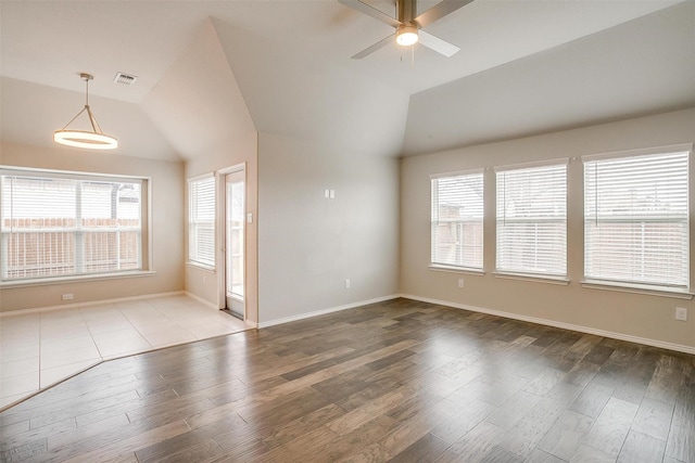 6328 Red Cliff Dr, Fort Worth, TX 76179 - spare room with healthy amount of natural light, ceiling fan, vaulted ceiling, wood finished floors, and baseboards