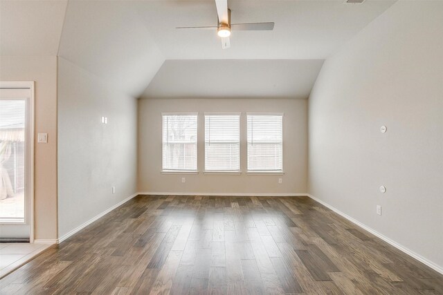 6328 Red Cliff Dr, Fort Worth, TX 76179 - empty room with ceiling fan, dark wood finished floors, vaulted ceiling, and baseboards
