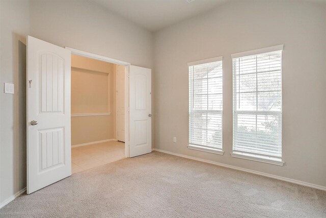 6328 Red Cliff Dr, Fort Worth, TX 76179 - unfurnished bedroom featuring carpet flooring, baseboards, and tile patterned flooring