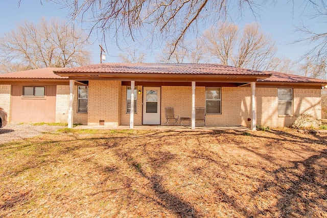 back of house with brick siding