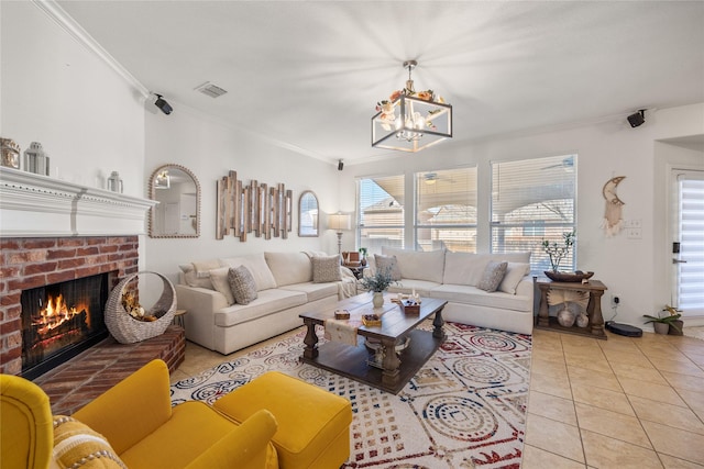 living area with tile patterned flooring, visible vents, crown molding, a fireplace, and a notable chandelier