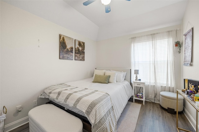 bedroom with ceiling fan, baseboards, and wood finished floors