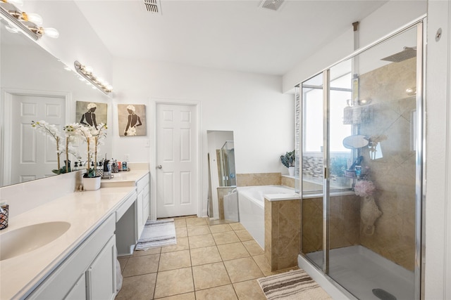 bathroom featuring tile patterned floors, visible vents, a stall shower, a bath, and vanity