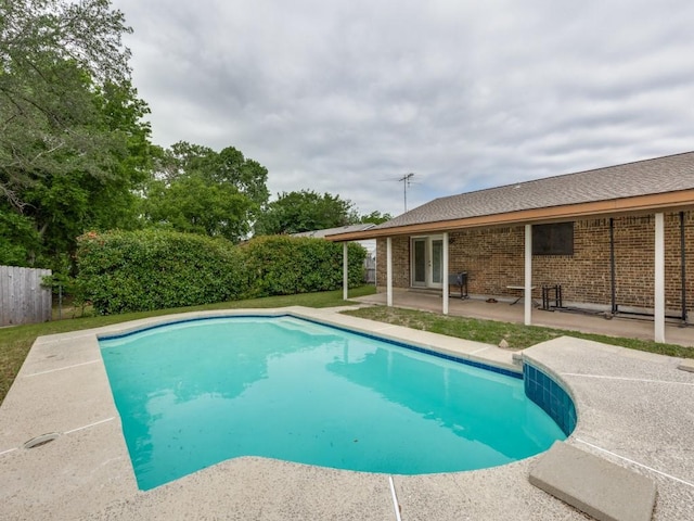 view of swimming pool with a patio area, a fenced in pool, french doors, and fence