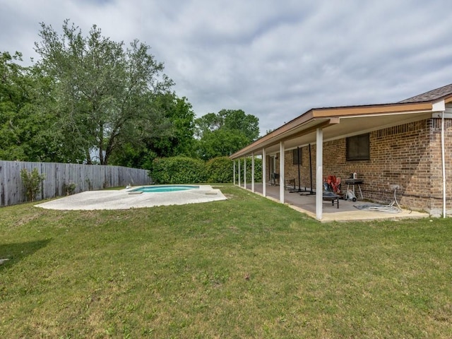 view of yard with a fenced in pool, a patio, and fence private yard