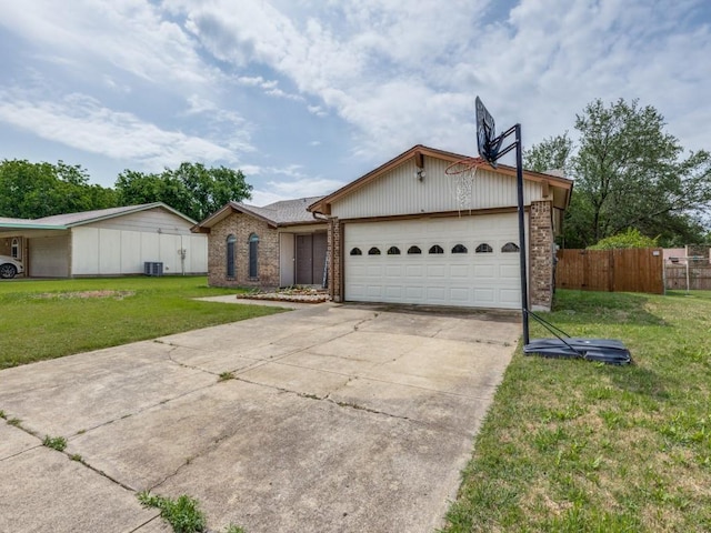 view of front of house with driveway, a front lawn, fence, a garage, and brick siding