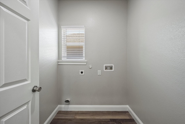 clothes washing area featuring dark wood-type flooring, baseboards, hookup for an electric dryer, hookup for a washing machine, and laundry area