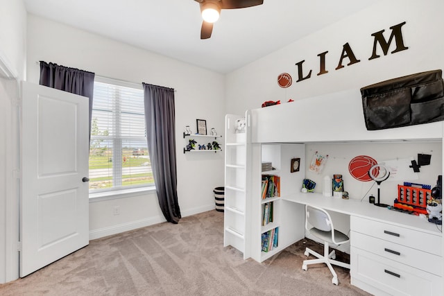 bedroom featuring baseboards, light carpet, and a ceiling fan