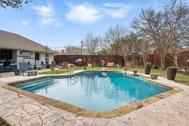 view of swimming pool featuring a fenced backyard, a fenced in pool, a diving board, and a patio