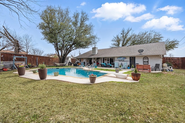 view of swimming pool with a fenced backyard, a patio area, and a fenced in pool
