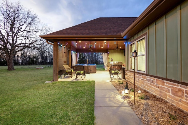 view of yard with a trampoline and a patio area