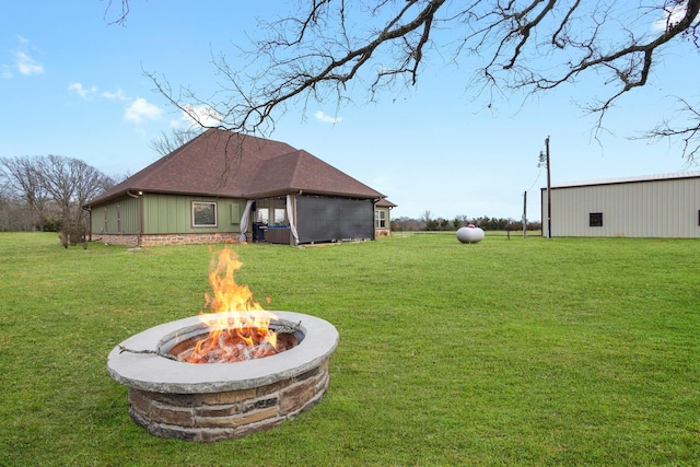 view of yard featuring a fire pit