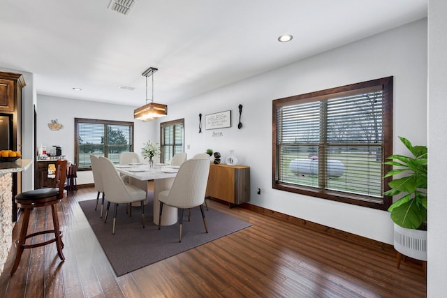 dining room with baseboards, dark wood-style floors, visible vents, and recessed lighting