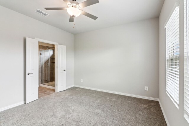 718 Caraway Dr, Princeton, TX 75071 - unfurnished bedroom with carpet floors, baseboards, ensuite bath, and a ceiling fan