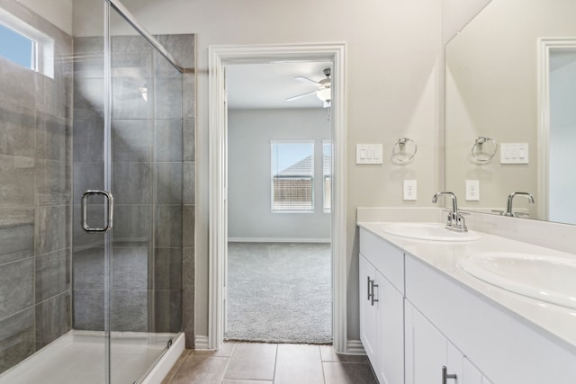 718 Caraway Dr, Princeton, TX 75071 - full bathroom featuring ceiling fan, tile patterned flooring, a shower stall, and double vanity