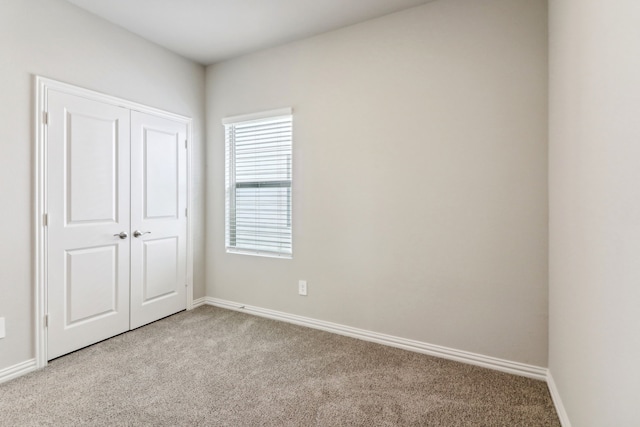 718 Caraway Dr, Princeton, TX 75071 - unfurnished bedroom with light carpet, a closet, and baseboards