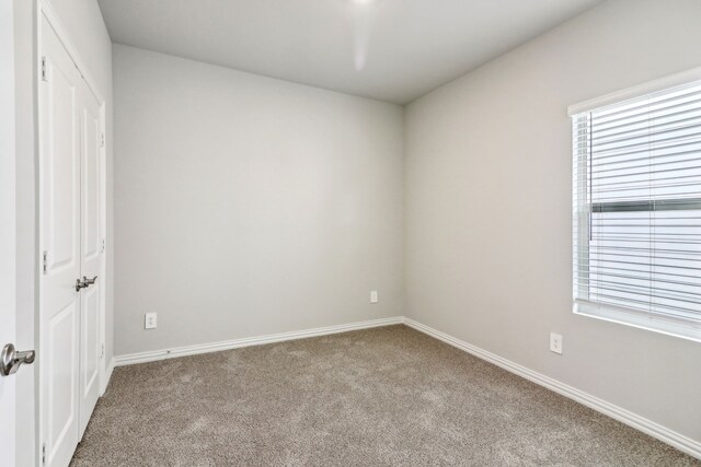 718 Caraway Dr, Princeton, TX 75071 - unfurnished bedroom with carpet floors, multiple windows, baseboards, and a closet