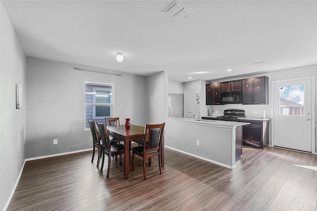 5625 Mcclelland St, Forney, TX 75126 - dining area featuring wood finished floors, healthy amount of natural light, baseboards, and recessed lighting