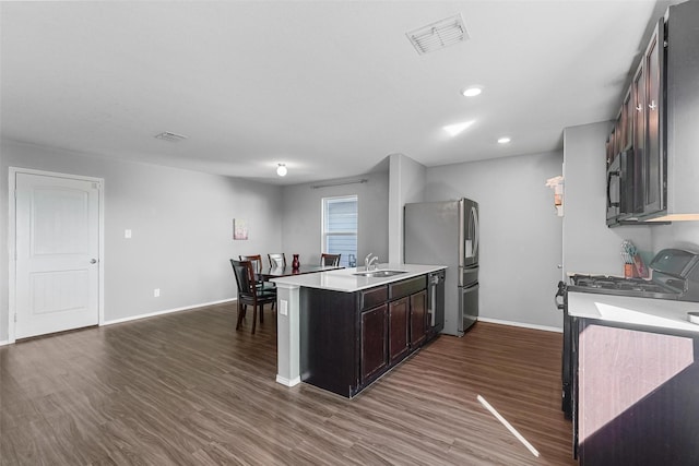 5625 Mcclelland St, Forney, TX 75126 - kitchen featuring a sink, black appliances, light countertops, baseboards, and dark wood-style flooring
