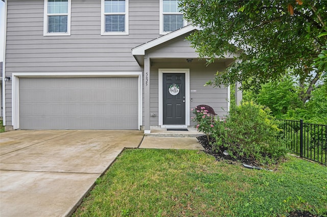 5625 Mcclelland St, Forney, TX 75126 - view of exterior entry with an attached garage and driveway