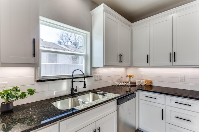 kitchen featuring a wealth of natural light, stainless steel dishwasher, ceiling fan, and a sink
