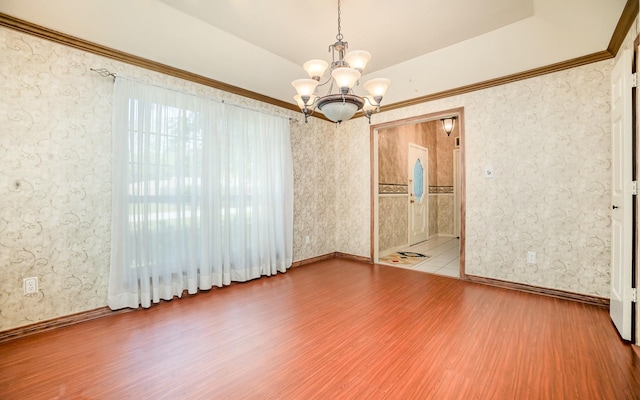 6608 Gold Dust Trl, Dallas, TX 75252 - spare room featuring a chandelier, wood finished floors, and wallpapered walls