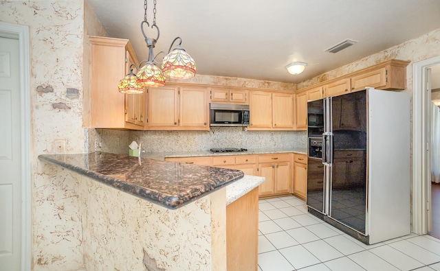 6608 Gold Dust Trl, Dallas, TX 75252 - kitchen with black fridge with ice dispenser, stainless steel microwave, light brown cabinets, and light tile patterned flooring