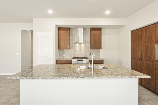 3255 Blossom Trl, Crandall, TX 75114 - kitchen with wall chimney range hood, a sink, gas range, tasteful backsplash, and a center island with sink
