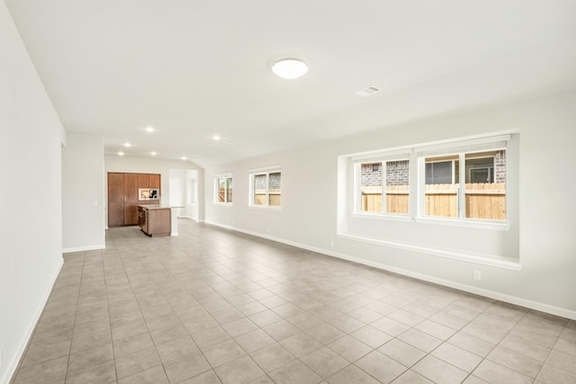 3255 Blossom Trl, Crandall, TX 75114 - unfurnished living room with baseboards, light tile patterned floors, and recessed lighting