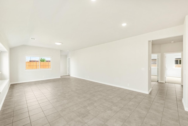 3255 Blossom Trl, Crandall, TX 75114 - spare room with recessed lighting, vaulted ceiling, light tile patterned floors, and baseboards