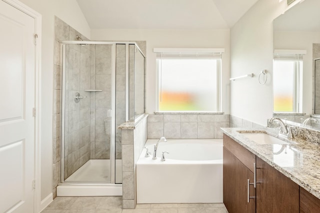 3255 Blossom Trl, Crandall, TX 75114 - full bathroom with plenty of natural light, a shower stall, vanity, a garden tub, and lofted ceiling