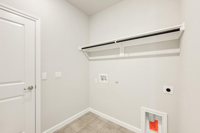 3255 Blossom Trl, Crandall, TX 75114 - laundry area featuring gas dryer hookup, hookup for an electric dryer, hookup for a washing machine, baseboards, and light tile patterned floors