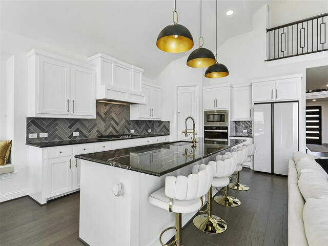 3141 Sunfish St, Prosper, TX 75078 - kitchen featuring a sink, appliances with stainless steel finishes, lofted ceiling, white cabinetry, and dark wood-style floors