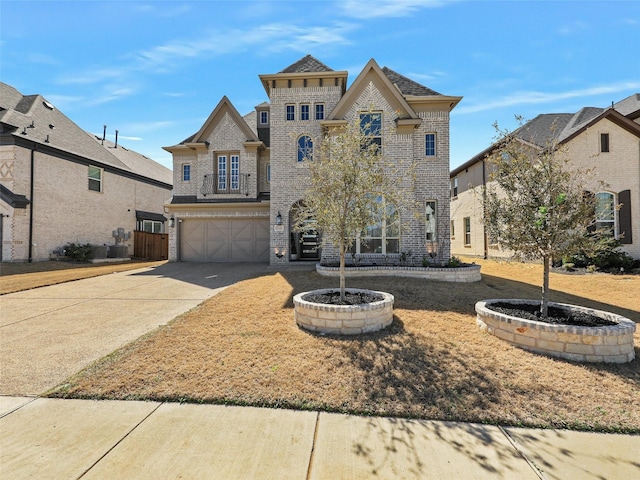 3141 Sunfish St, Prosper, TX 75078 - view of front of property featuring brick siding, an attached garage, and concrete driveway
