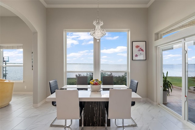 241 Loon Bay Dr, Gun Barrel City, TX 75156 - dining room featuring arched walkways, marble finish floor, baseboards, and a water view