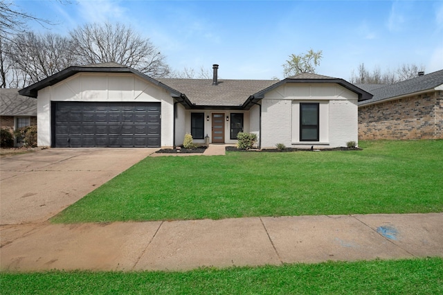 view of front of home with driveway, a shingled roof, an attached garage, a front yard, and brick siding