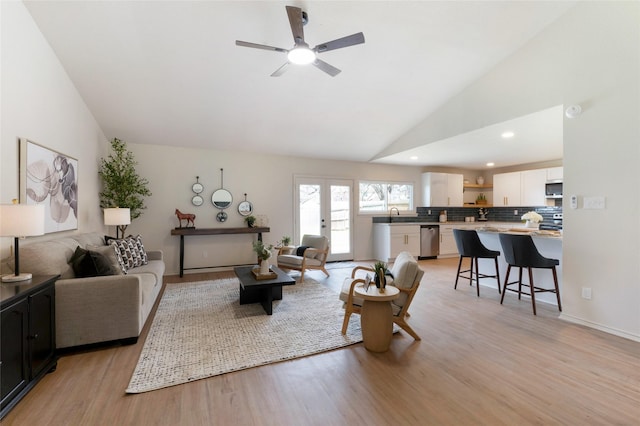 living area featuring light wood-style flooring, recessed lighting, a ceiling fan, and high vaulted ceiling