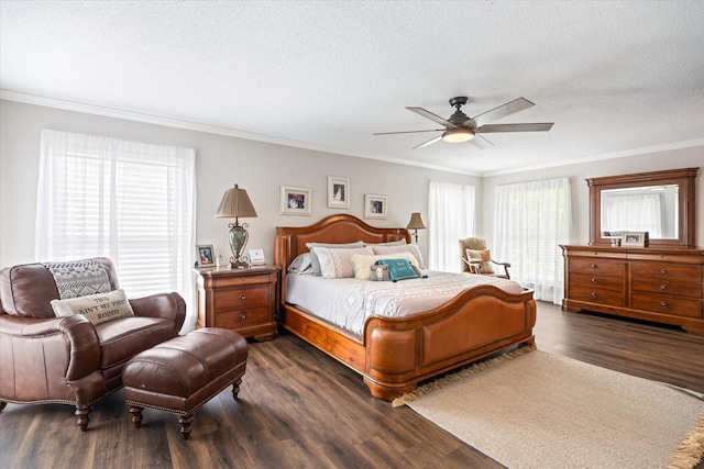 bedroom featuring dark wood finished floors, a textured ceiling, crown molding, and ceiling fan