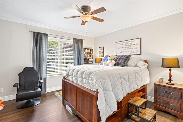 bedroom featuring ornamental molding, a ceiling fan, a textured ceiling, wood finished floors, and baseboards